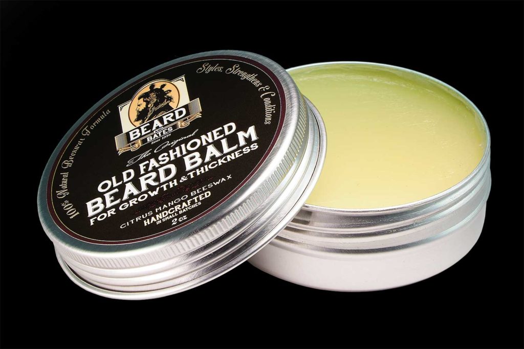 Beard And Bates recreates the one-of-a-kind 19th century beard balm that is utilized for its hair nourishing, skin rejuvenating and gentle conditioning properties. This exceptional balm incorporates the finest ingredients: Jojoba Oil: which closely resembles natural skin oils provides a powerhouse of nourishing vitamins and minerals for promoting hair growth and hydration, and for creating healthy skin. Argan Oil: this "miracle oil" fights hair loss, dandruff, tames unruly frizz and curls, makes hairs silkier and smoother by nourishing and hydrating the follicles, has an exceptionally high fatty acid and Vitamin E content, and has proven anti-aging properties for the skin. Grapeseed Oil: this anti-oxidant and linoleic acid rich oil fights acne and blemishes, tightens the skin, accelerates hair growth, and imparts a natural shine as it conditions hair. Mango Butter: nourishing plant butter rich in many nutrients and antioxidants; a potent anti-inflamatory, anti-fungal, and anti-bacterial butter will keep skin healthy; restores and maintains moisture and promotes cell regeneration in hair and skin; contributes to healthy hair growth; locks in moisture. Beeswax: nourishes and locks in moisture in hair; is a potent anti-inflammatory, anti-fungal and anti-bacterial; clears acne, eczema and psoriasis; natural styling agent. The light essential essence of sweet orange compliments the beeswax and mango butter to provide a warm and inviting fragrance. The balm is optimized for nourishing, conditioning and light styling properties, so it does not have the hold of styling waxes. Treat your beard and skin right with this amazing balm and see the difference.