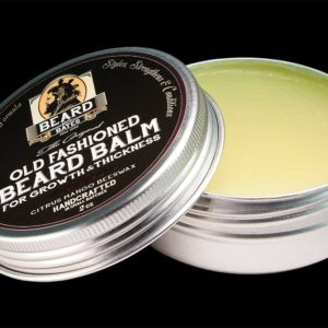 Beard And Bates recreates the one-of-a-kind 19th century beard balm that is utilized for its hair nourishing, skin rejuvenating and gentle conditioning properties. This exceptional balm incorporates the finest ingredients: Jojoba Oil: which closely resembles natural skin oils provides a powerhouse of nourishing vitamins and minerals for promoting hair growth and hydration, and for creating healthy skin. Argan Oil: this "miracle oil" fights hair loss, dandruff, tames unruly frizz and curls, makes hairs silkier and smoother by nourishing and hydrating the follicles, has an exceptionally high fatty acid and Vitamin E content, and has proven anti-aging properties for the skin. Grapeseed Oil: this anti-oxidant and linoleic acid rich oil fights acne and blemishes, tightens the skin, accelerates hair growth, and imparts a natural shine as it conditions hair. Mango Butter: nourishing plant butter rich in many nutrients and antioxidants; a potent anti-inflamatory, anti-fungal, and anti-bacterial butter will keep skin healthy; restores and maintains moisture and promotes cell regeneration in hair and skin; contributes to healthy hair growth; locks in moisture. Beeswax: nourishes and locks in moisture in hair; is a potent anti-inflammatory, anti-fungal and anti-bacterial; clears acne, eczema and psoriasis; natural styling agent. The light essential essence of sweet orange compliments the beeswax and mango butter to provide a warm and inviting fragrance. The balm is optimized for nourishing, conditioning and light styling properties, so it does not have the hold of styling waxes. Treat your beard and skin right with this amazing balm and see the difference.